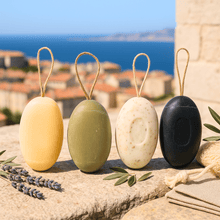 Load image into Gallery viewer, Corded Pebble Soaps / Galet Soaps in a group photo